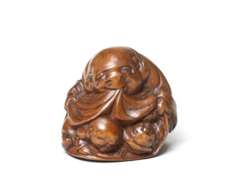 A wood netsuke of HoteiBy Matsushita Otoman, Hakata, mid-19th centuryHotei smiling sweetly, holding the edge of his treasure 