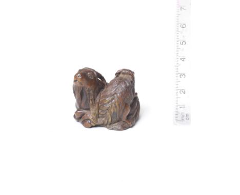 A boxwood netsuke of a goat and kidBy Tametaka, Nagoya, late 18th centuryThe parent recumbent upon a bed of fallen leaves, it