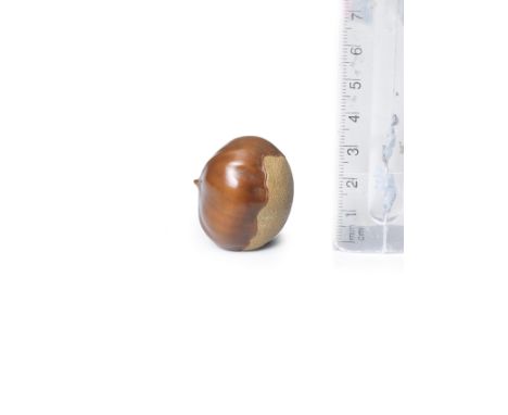 A boxwood netsuke of a chestnutBy Ouchi Sosui (1911-1972), mid-20th centuryThe chestnut of slightly flattened form, carved in