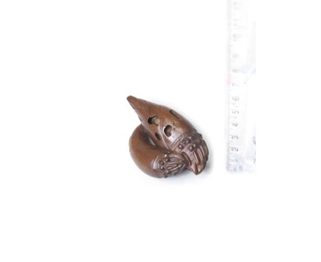 A wood netsuke of bamboo shootsBy Yoshikazu, late 19th centuryThe two bamboo shoots carved side-by-side, one curling beneath 