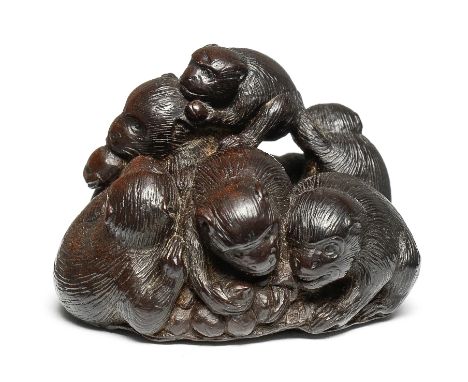A wood netsuke of a group of monkeysBy Tametaka, Nagoya, 18th centuryComprising four adults and three young, the monkeys sitt