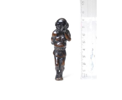 A wood netsuke of a coral fishermanBy Miwa, Edo, late 18th centuryThe fisherman standing, wearing a short wrap-around skirt t