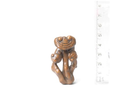 A wood netsuke of reishi fungusBy Shibata Zeshin (1807-1891), late 19th centuryThe four stalks of fungi with heads of differi