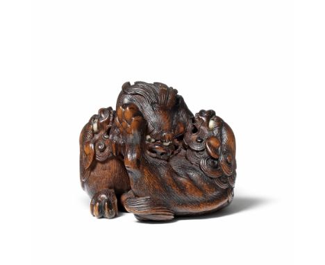 A wood netsuke of three shishiBy Sato Masayoshi, mid-19th centuryThe shishi playfully fighting, two rolling on their sides wi