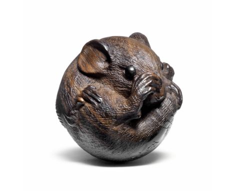 A kurogaki (black persimmon) wood netsuke of a coiled ratBy Masanao, Ise, 19th centuryThe rat curled in a typical attitude, o