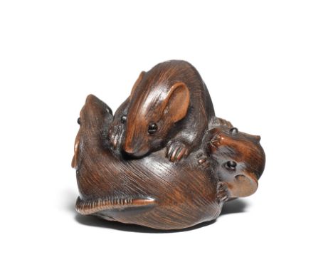 A wood netsuke of three ratsBy Kazutomo, Gifu, 19th centuryTwo of the rats curling around the other, the third crawling on to
