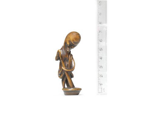 A wood netsuke of an octopusBy Miwa, Edo, early 19th centuryThe anthropomorphic octopus standing, dressed in a sleeveless hao