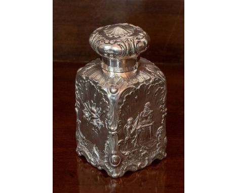 A Continental silver Tea Caddy, of square section, embossed leaves and   scrolls and embossed to each side with vignette of c