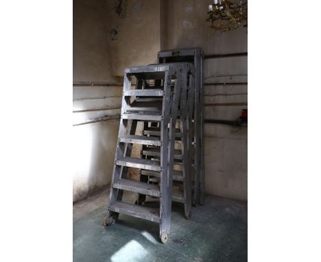 Three sets of aluminium industrial step ladders NB May not fulfil modern safety standards. Sold as decorative items only  OBJ