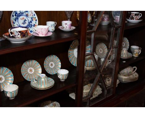 A Davenport porcelain tea set, early 19th century, with bright blue and gilt tab decoration, of 12 saucers, 5 teacups, 5 coff