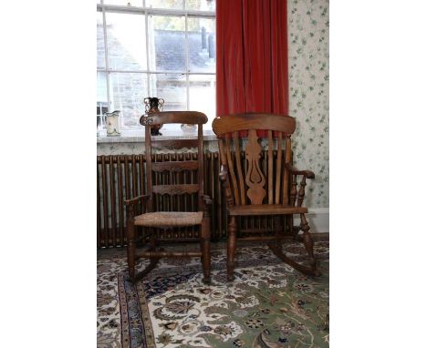 A Windsor rocking Elbow Chair with pierced splat and lath back, solid seat, turned supports. And a 19th century rocking chair