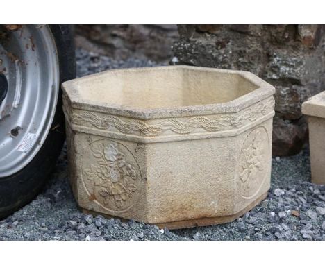 A “Sandford Stone” octagonal planter, late 20th century, cast with circular floral panels, 51cm wide. A square jardiniere. A 