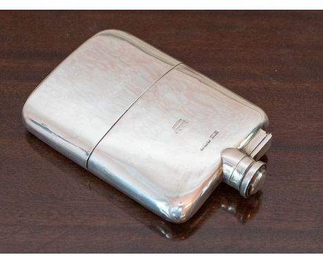 A George V silver Hip Flask of plain curved form, engraved coronet to the  front and with detachable silver cup to base with 