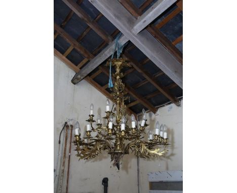 A 19th century rococo revival gilt brass six branch/24 light chandelier, each main branch with two outer small branches surmo