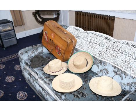 A Far Eastern broad rimmed fieldworkers plaited straw/sennit hat. Four other hats and a leather suitcase with Cunard Line lab