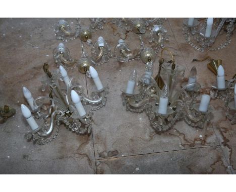 A set of five glass 5 branch chandeliers with S scroll branches and bead swags, third quarter 20th century, and an eight bran