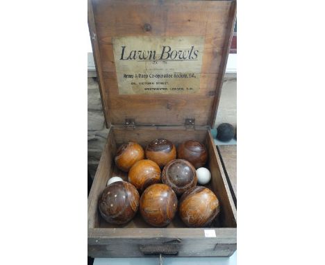 A set of lawn bowl, Army & Navy Cooperative Society Ltd, boxed; table; and a croquet set Jacques & Co London and metal croque