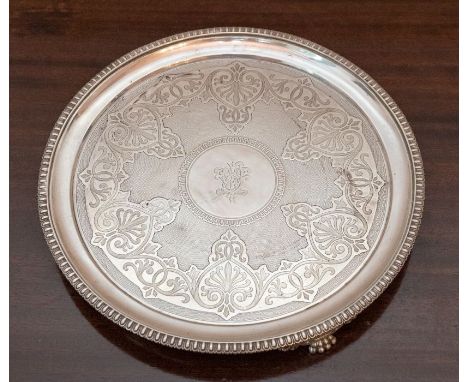 A Victorian silver circular Salver, engine-turned and engraved with  anthemion trailing leafage scrolls, the edge cast egg an