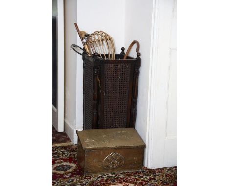 A 1930’s oak and caned stick stand, tapering square section. A brass covered slippers box. Sundry sticks. Sundry items (3)   