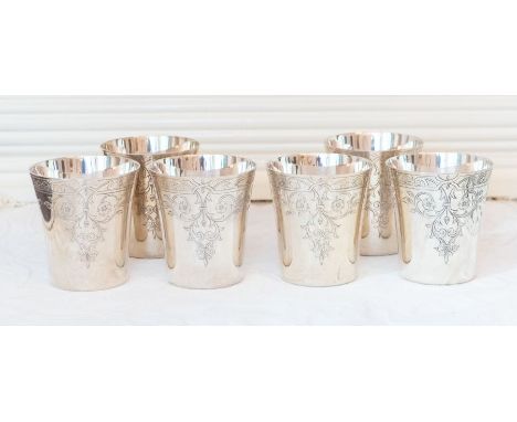 A Set of six silver Beakers of straight tapered form with flared rims and  engraved floral leafage scroll and strap-work, Bir