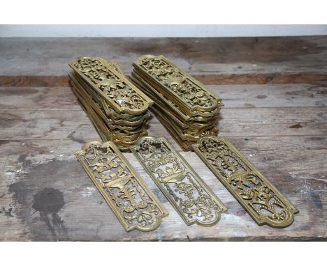 A group of 38 neo-classical pierced and gilt- brass door finger-plates, average 27cm high. A collection of similarly designed