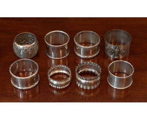 A Pair of George V silver Napkin Rings with reeded borders, London 1915,  marks rubbed, 2.76oz, a Victorian Napkin Ring embos