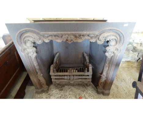 A large cast iron fireplace with dog grate, 97cm x 97cmOBJECT LOCATION: TOP OUT BUILDING