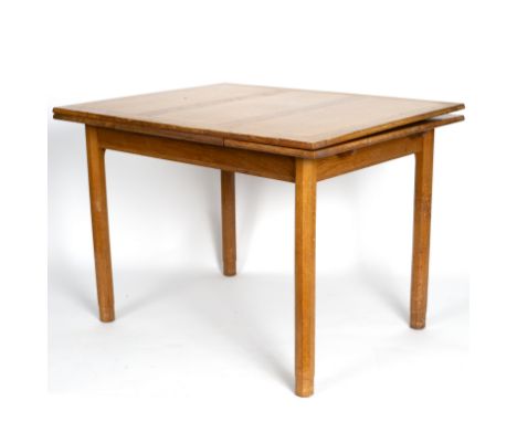 Gordon Russell, British mid 20th Century, a light oak extending dining table, on octagonal column legs, 106cm long (167cm ext