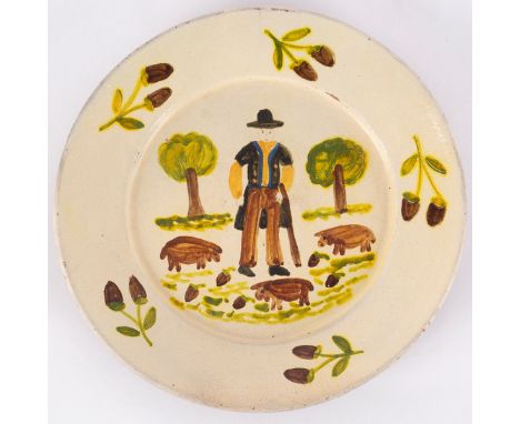 Adriano Martelo, a glazed pottery plate painted a farmer with pigs and acorns, incised marks to reverse N4 Redondo Portugal, 