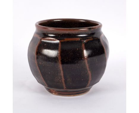 Nic Harrison (born 1949), a cut-sided stoneware vase of globular form covered in tenmoku glaze, impressed NH mark, 13cm high 