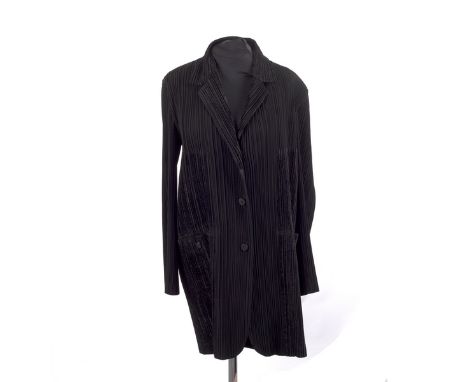 An Issey Miyake black long-line fitted jacket, with revere collar and button patch pockets CONDITION REPORT: Marked Size M. S