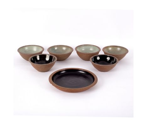 Studio Pottery, a set of four stoneware bowls, with ash glazed interior, each stamped RB England, 13.5cm diameter, two small 