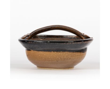 John Maltby (born 1936), a square stoneware basket, the interior painted flowerheads, with looping handle, 20cm wide/Provenan