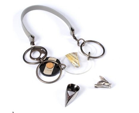 A Marni choker type necklace, mixed materials, a silver bee brooch and a modernist Britannia silver ring, set with ruby colou