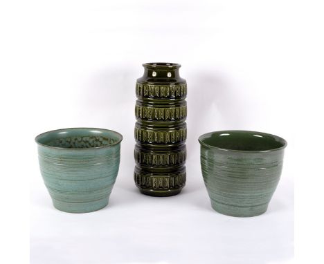 A 1970s German cylindrical vase, olive green glaze, 41cm high and two green ceramic planters, 25cm diameter [3]