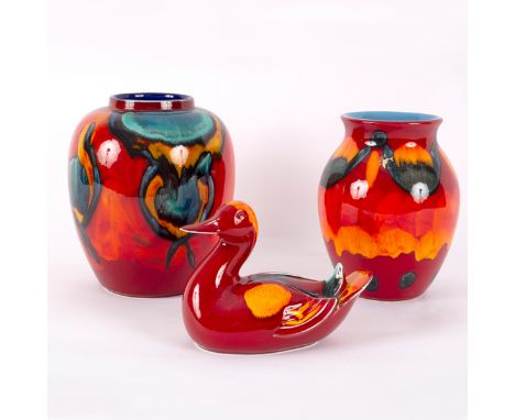 Poole Pottery, a 'peacock' pattern ginger jar, 22cm high, a 'volcano' vase, 20cm high and a similar pattern duck, 19cm wide [
