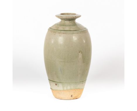 Richard Batterham (born 1936), a stoneware bottle vase, tapering form with flared neck, green ash glaze with ribbed bands to 