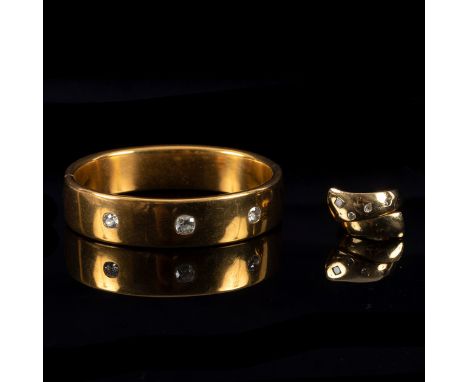 A French yellow gold hinged bangle set with three cushion shaped diamonds, approximately 33.3gm and an 18ct yellow gold ring 
