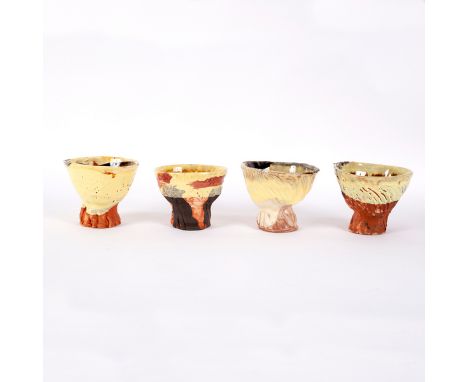 Simon Carroll (1964-2009), four earthenware teabowls with coloured glazes, 10cm high and smaller [4] CONDITION REPORT: One ha