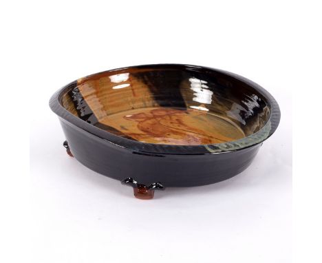 Francoise Dufayard (born 1960), a ceramic bowl of irregular circular form, deep sided, on four lug feet, signature to base, 3