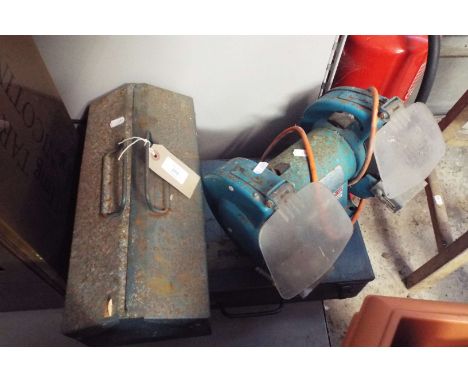A bench grinder, a tool box and an angle grinder