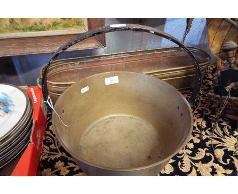 A brass jam pan and a window trough