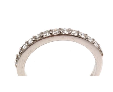 Diamond half hoop eternity ring, the thirteen brilliant cut diamonds in 18ct white gold mount and shank, ring size K.