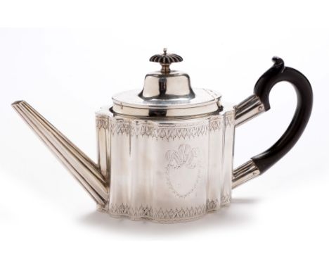 A George III silver teapot, no maker's mark, Newcastle 1788, of commode form with engraved leaf decoration and shield cartouc