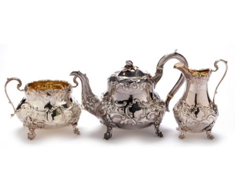 A Victorian three piece silver tea servic e, by John Wellby, London 1847 , each piece of baluster form with leaf scrolls and 