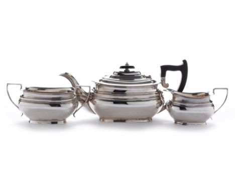 A George V three-piece silver tea set, by Edward &amp; Sons, Sheffield 1933, of oval ribbed form with engraved Fleming crest 