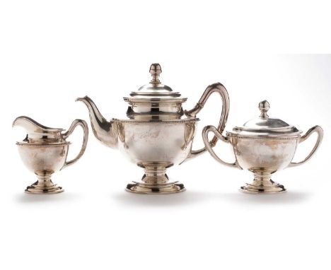 Austro-Hungarian silver three-piece tea service, by Eduard Friedman, Vienna late 19th Century, with beaded rims, acorn finial