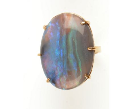 Opal ring, the oval opal cabochon measuring 30.1 x 22.5mm, the yellow metal shank stamped 9ct', ring size Q.