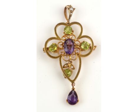 An Edwardian Suffragette pendant/brooch, the central oval facet cut amethyst above a pear-cut amethyst, surrounded by circula