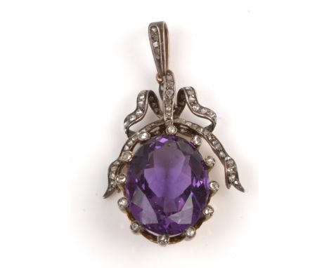 Edwardian amethyst and diamond pendant, the oval facet cut amethyst measuring 22 x 17 x 11mm, set within twelve rose cut diam